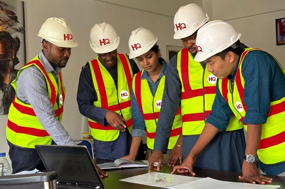Construction_team_reviewing_plans HQ Nigeria Limited - How to Choose the Right Construction Company in Abuja